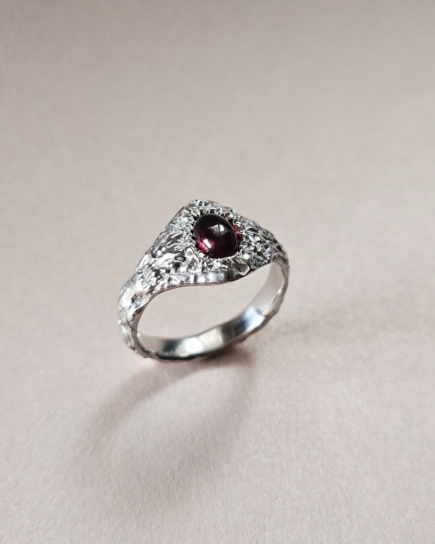 Rustic ring with garnet stone