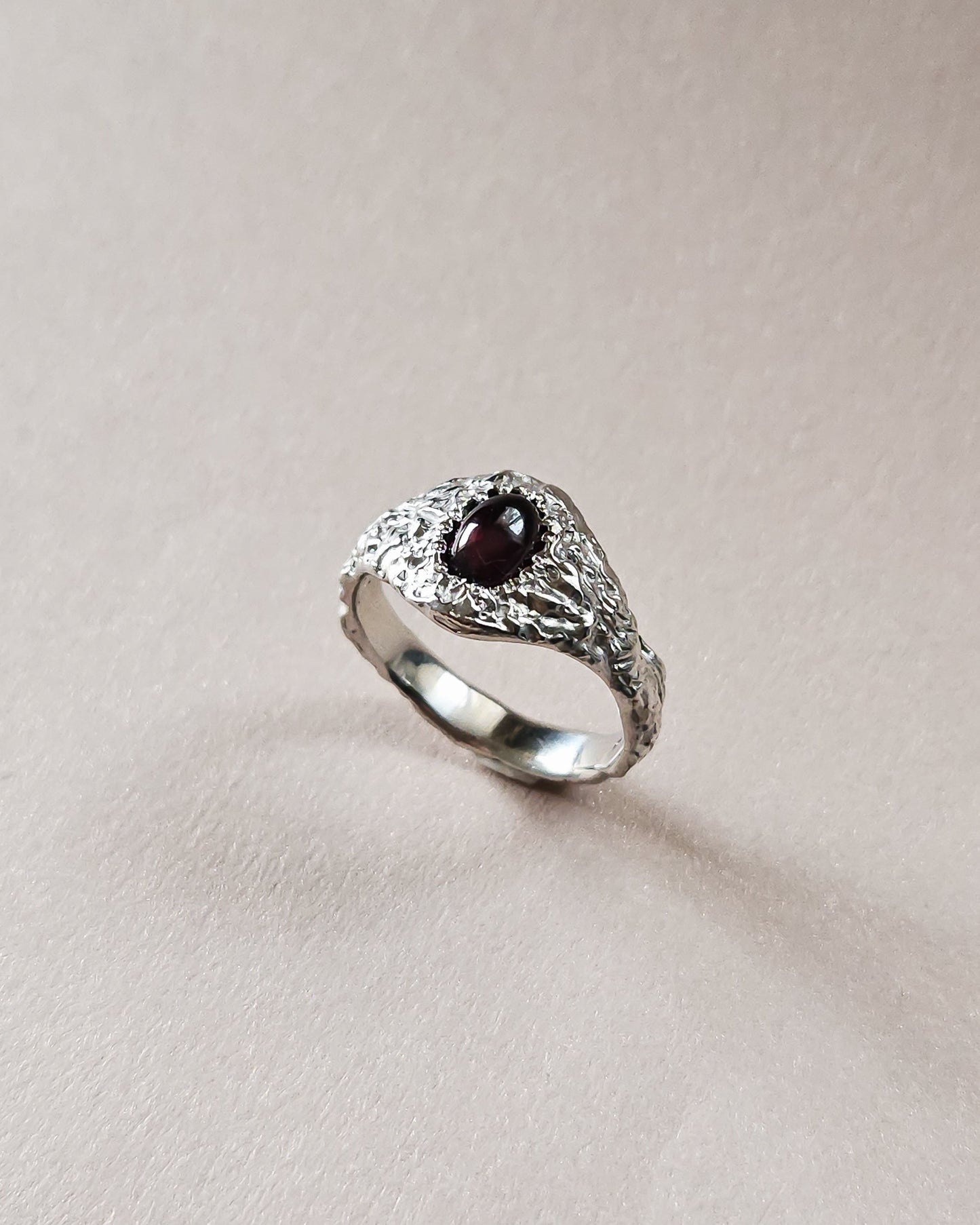 Rustic ring with garnet stone