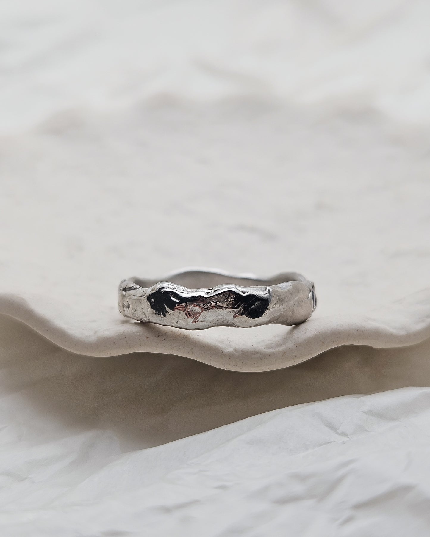 Melted ring with light blue sapphire