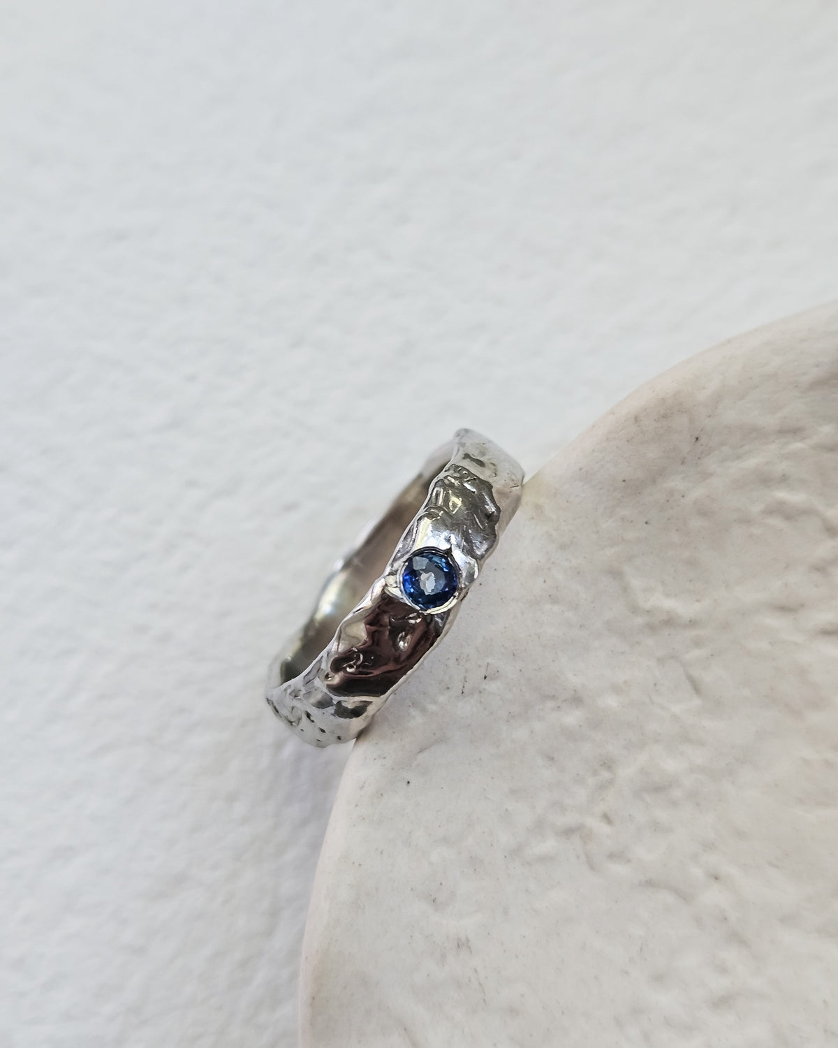 Melted ring with sapphire