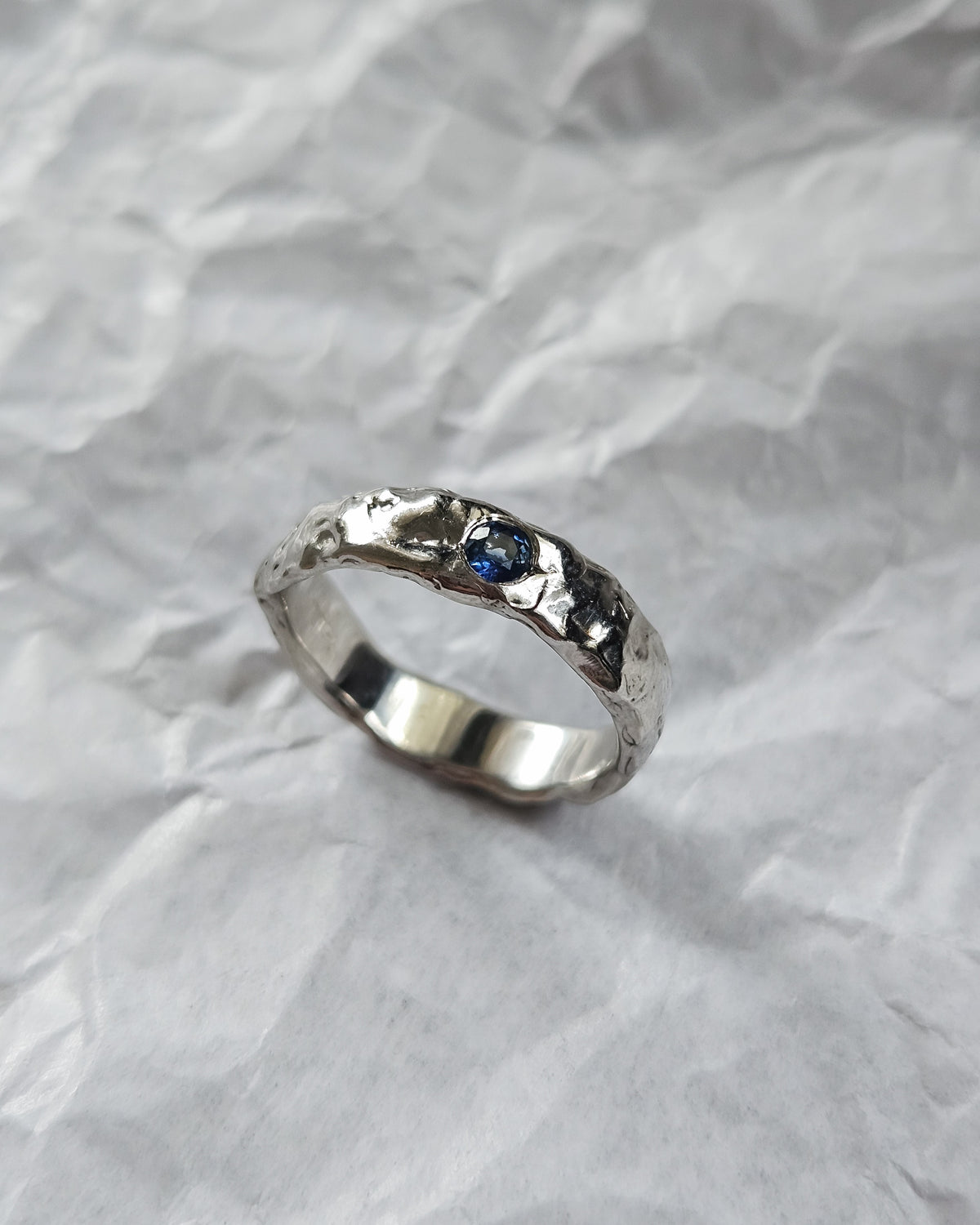 Melted ring with sapphire