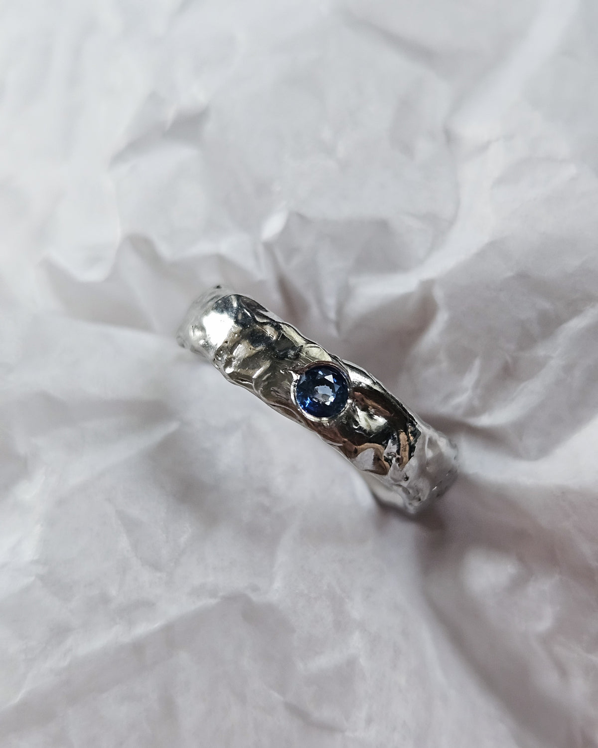 Melted ring with sapphire