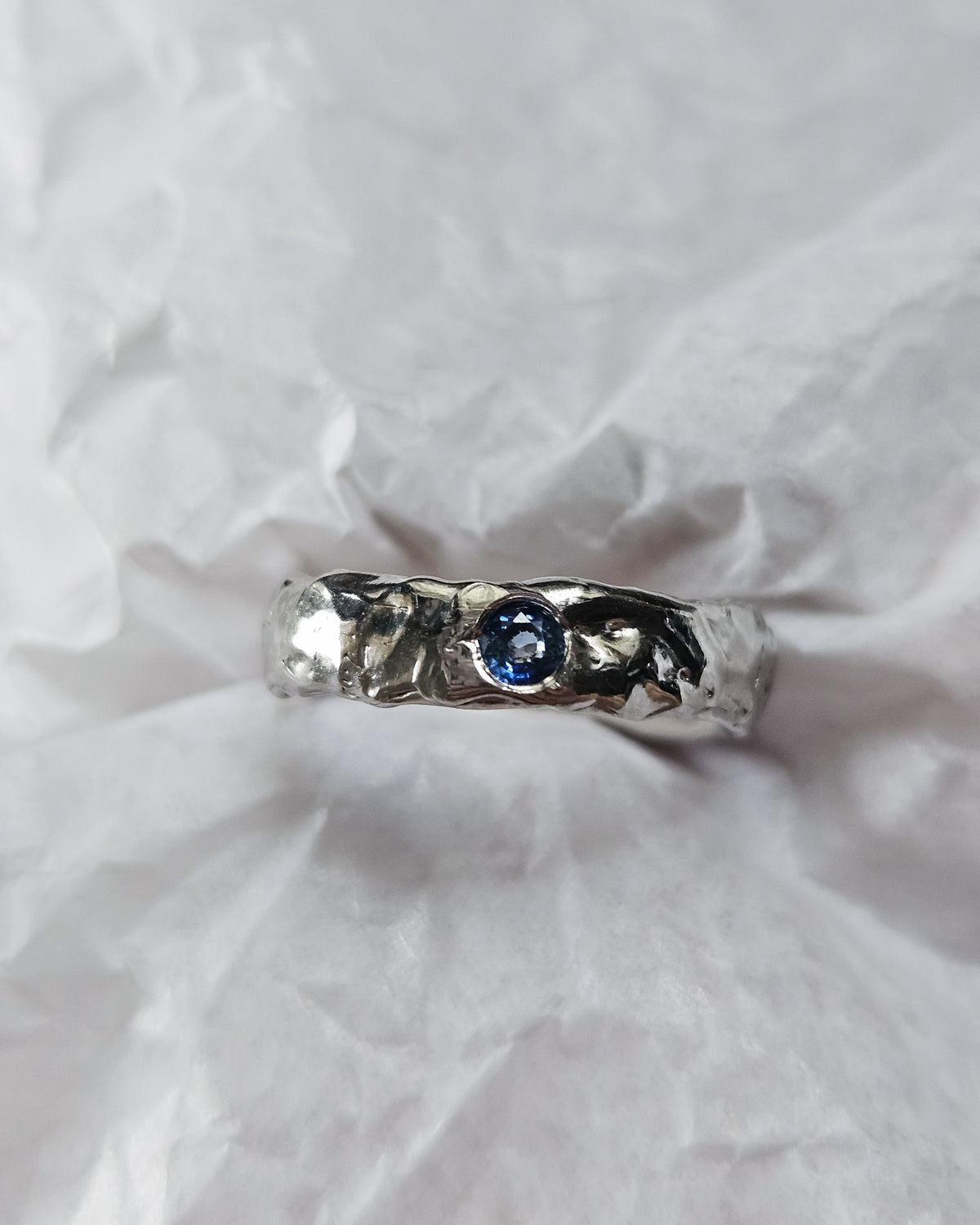 Melted ring with sapphire