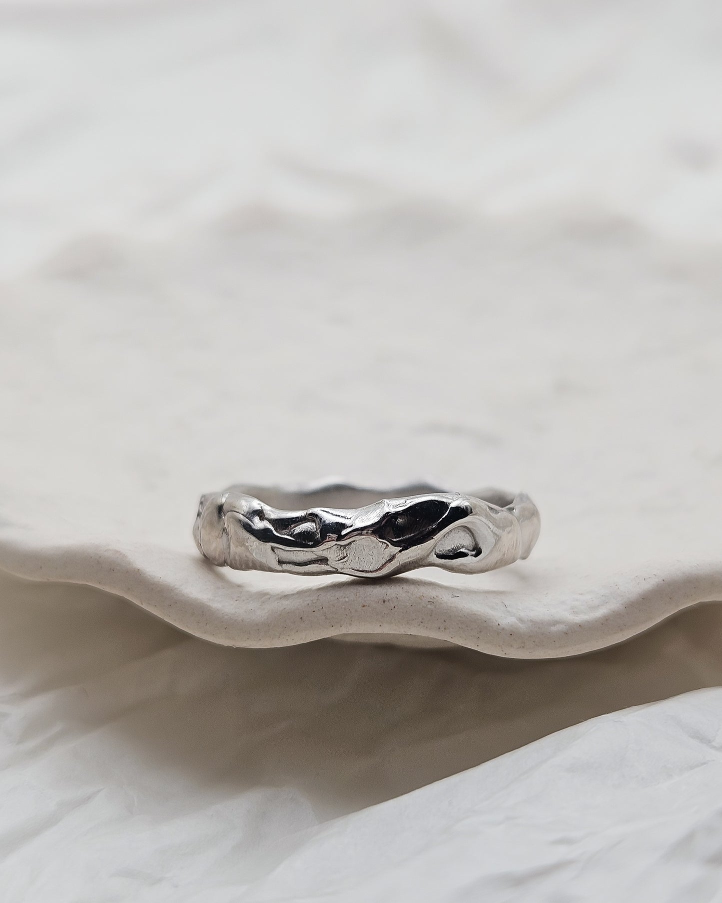 Melted ring with light blue sapphire