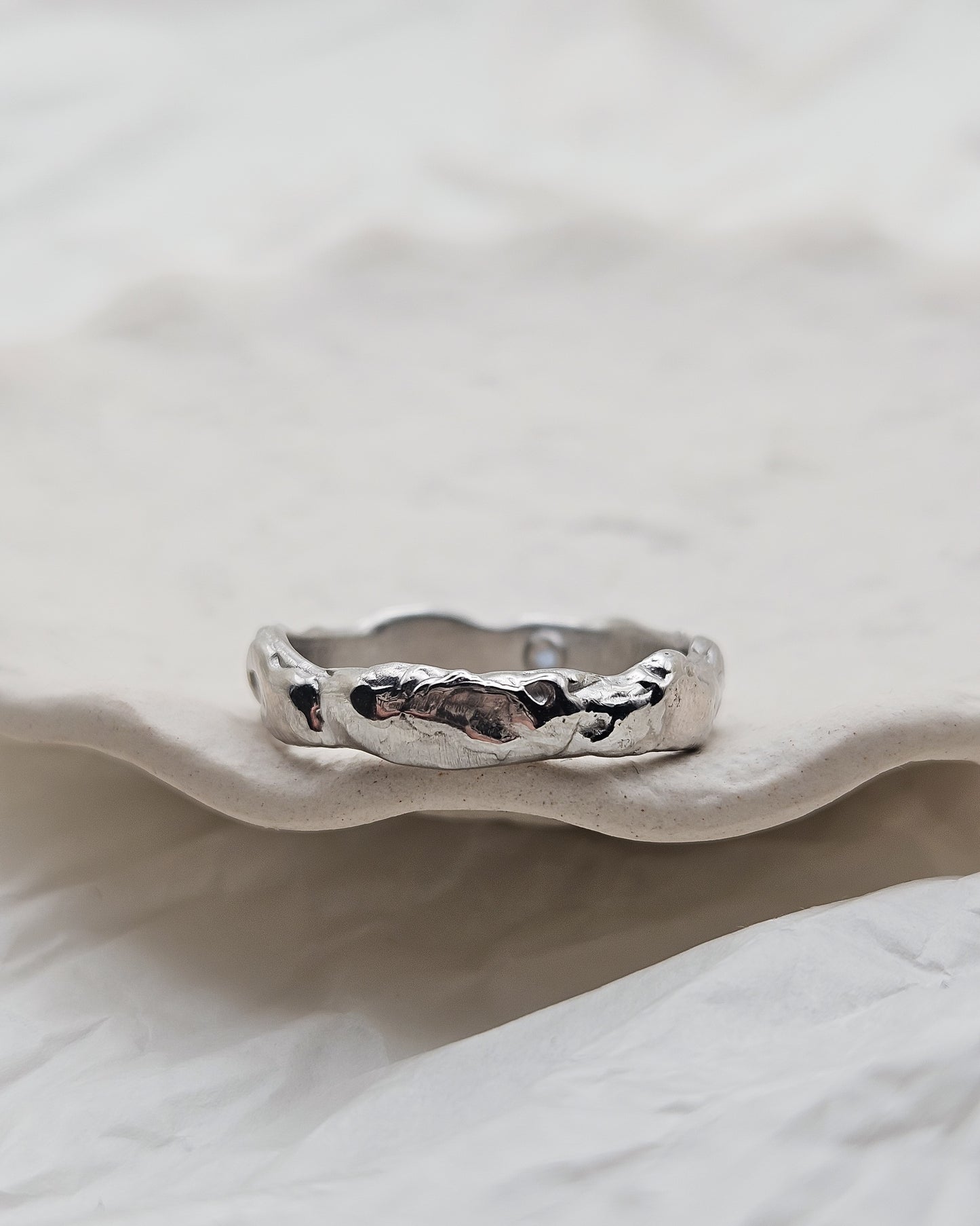 Melted ring with light blue sapphire